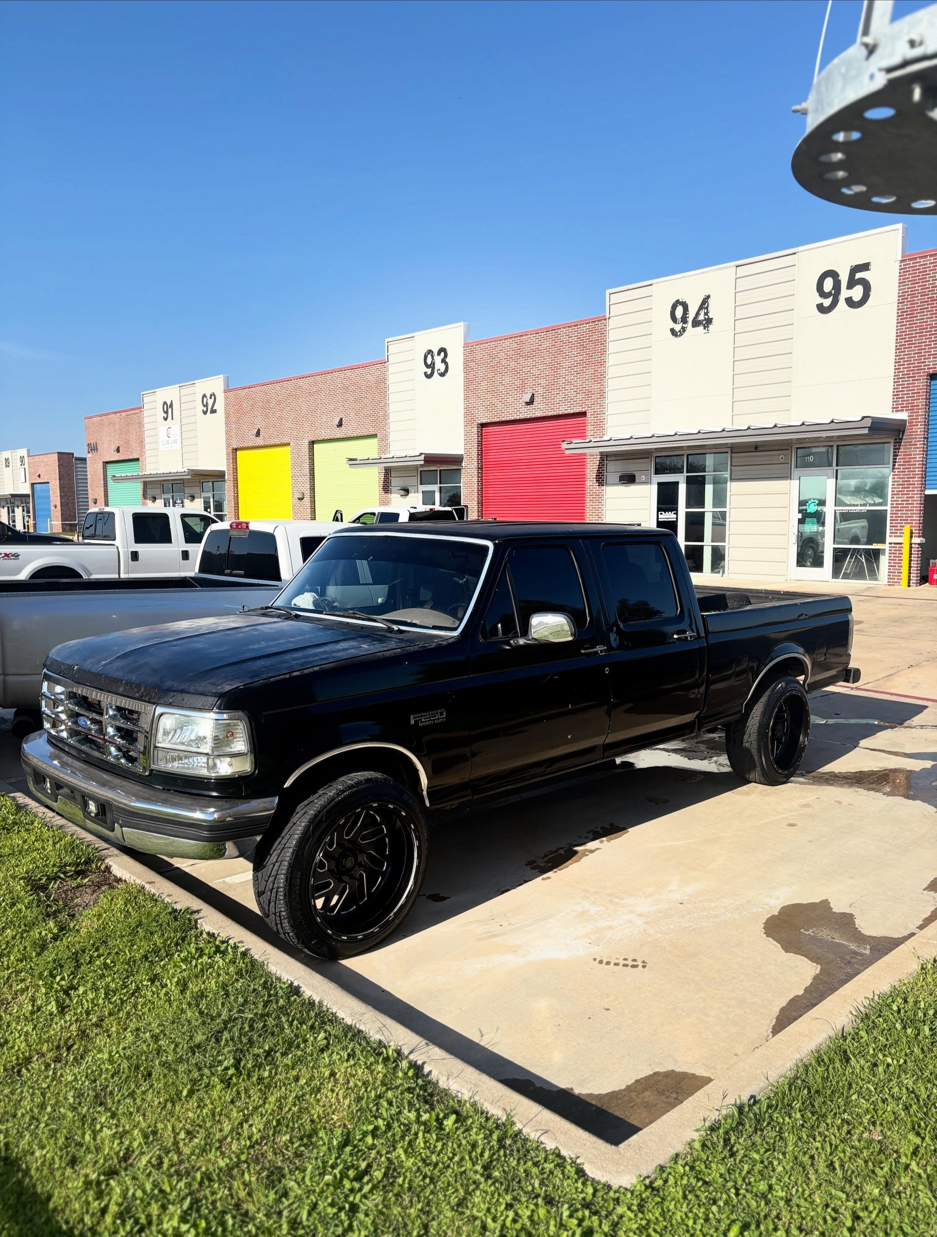 Black F-250 with full window tint